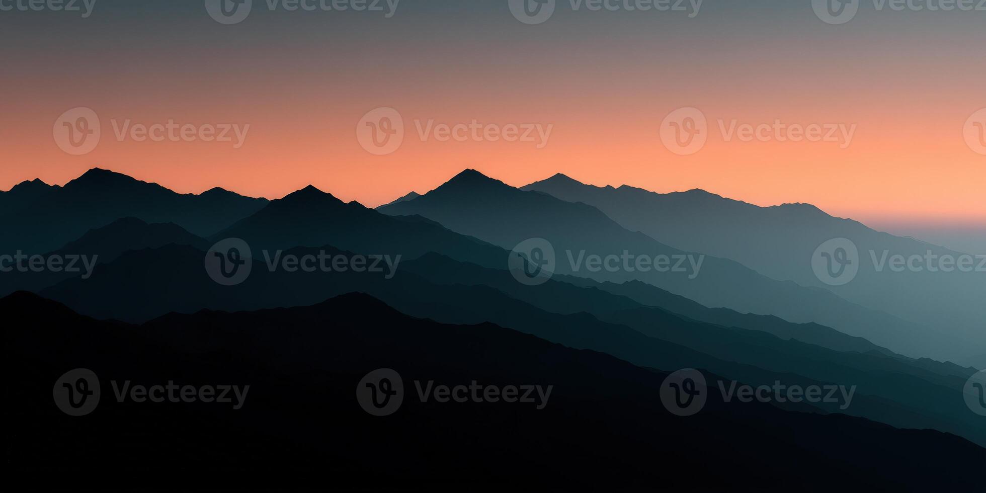 Mountains at sunset with a blue sky photo
