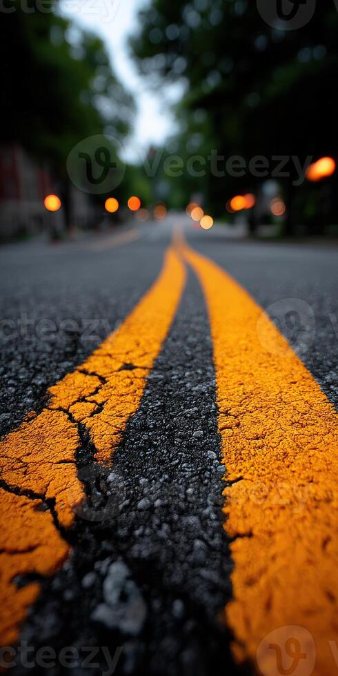 A blurry image of a road with yellow lines photo