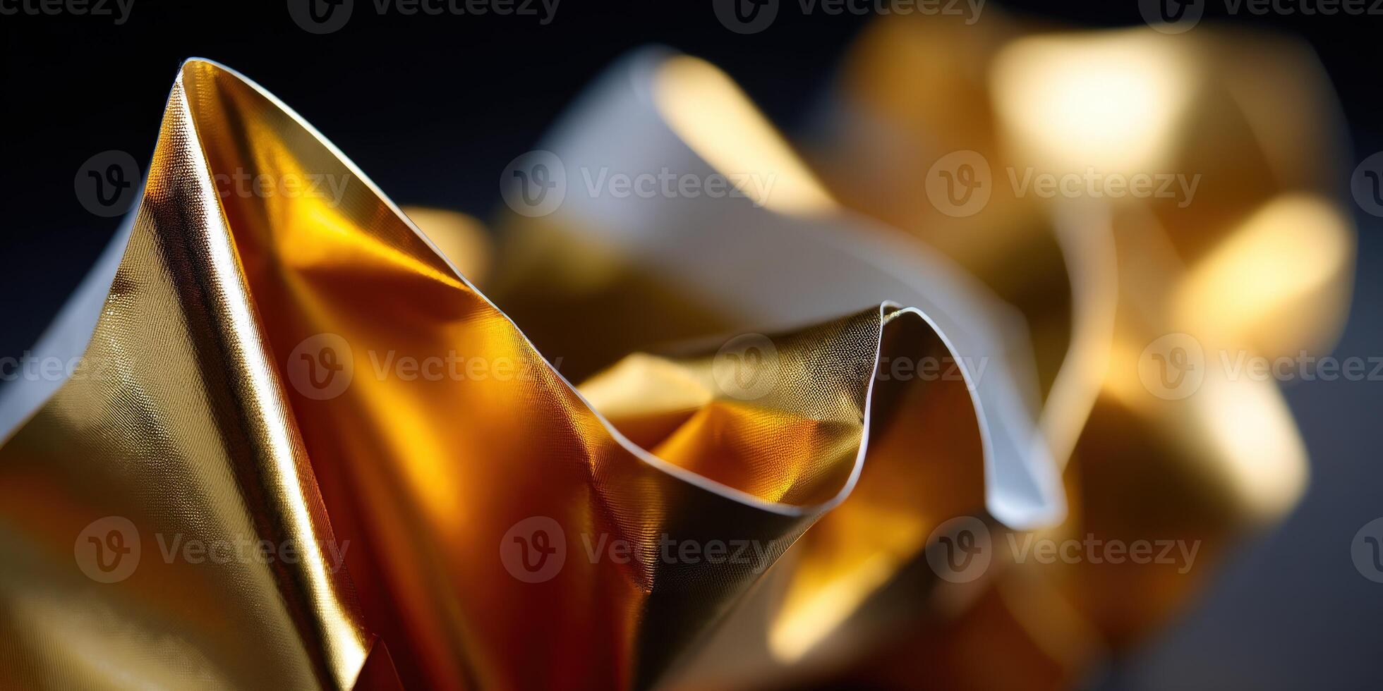 Elegant folds of golden and white fabric create texture photo
