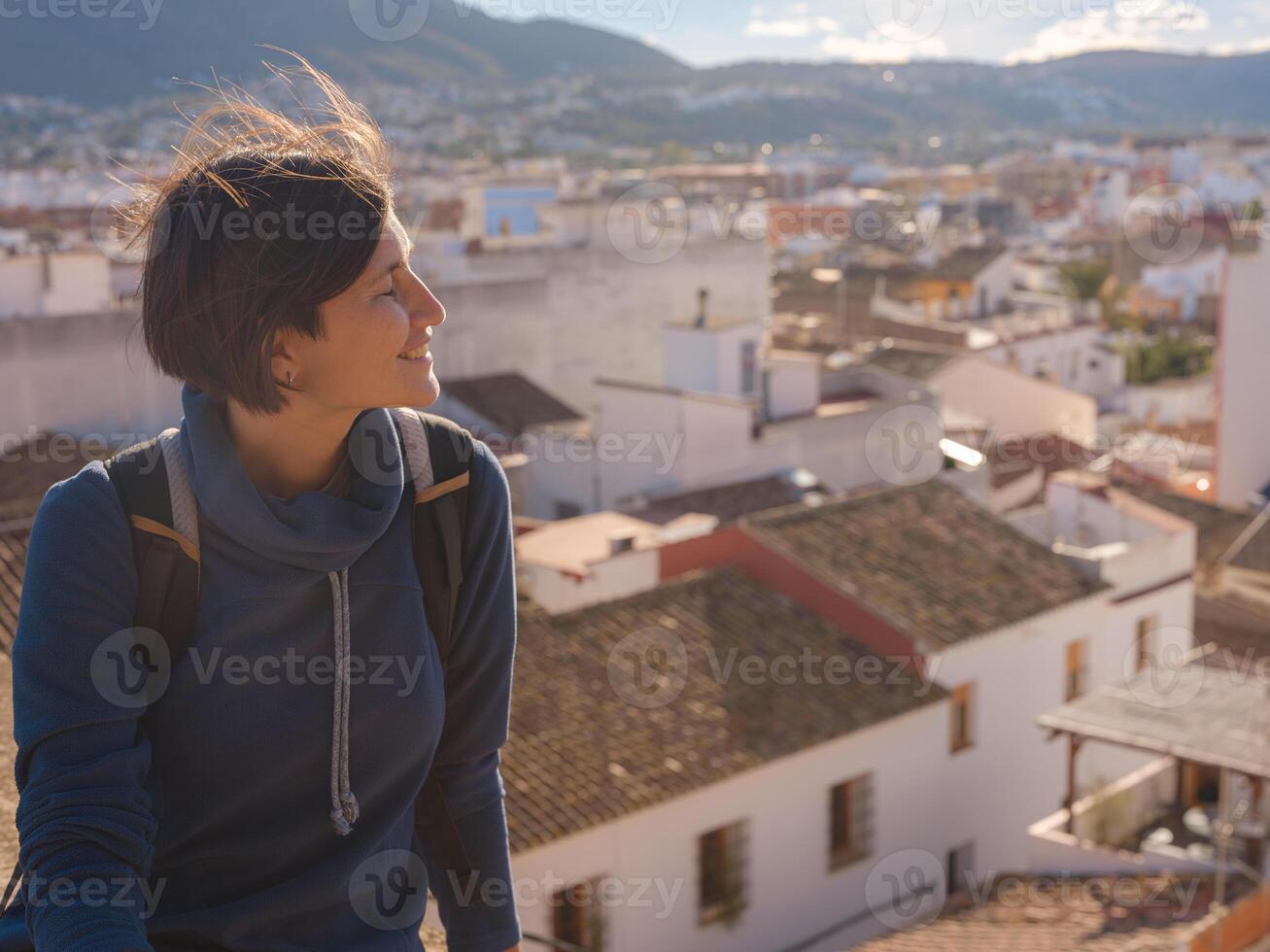 Young asian woman exploring historic castle in Denia photo
