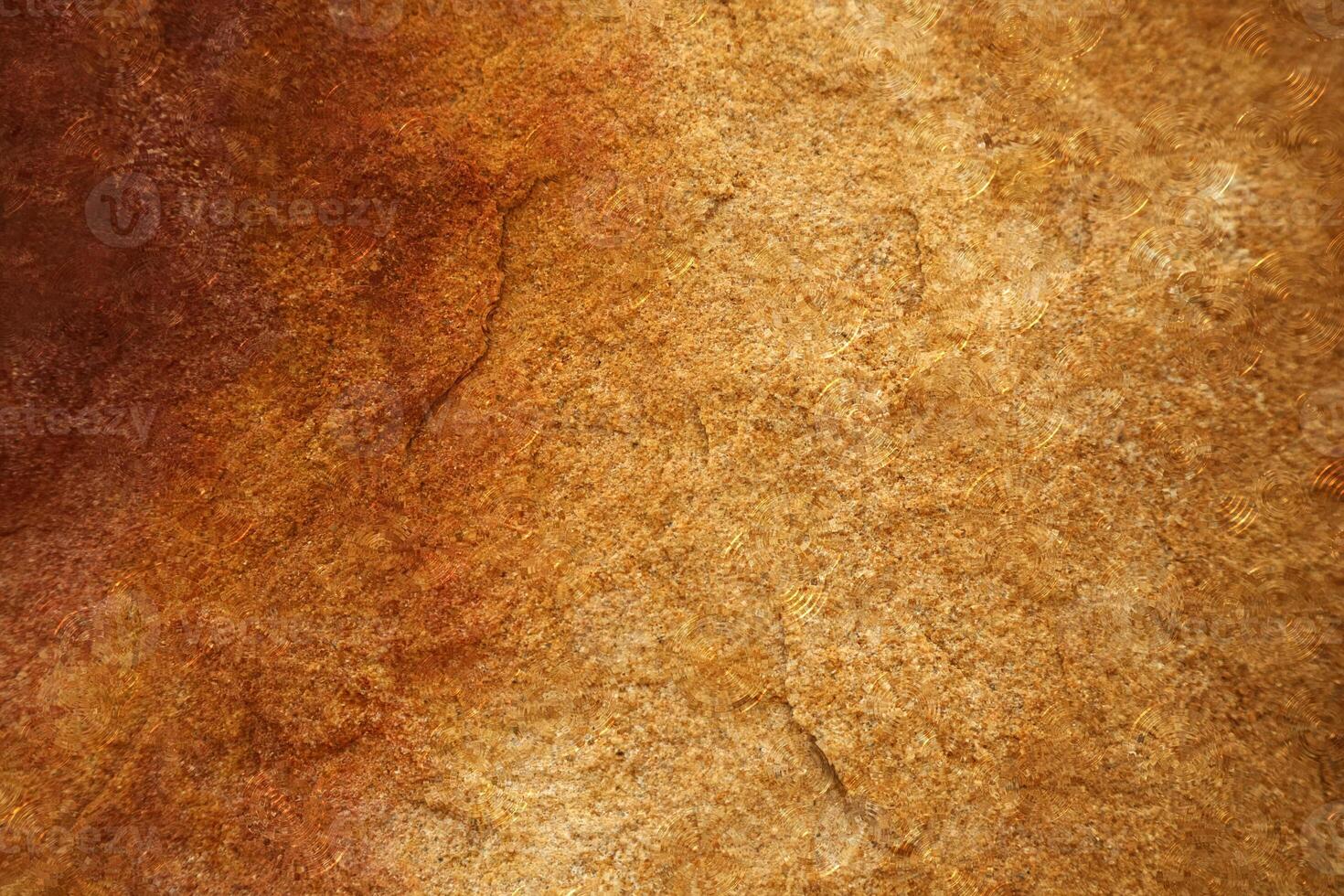 A brown and red stone wall with a brown stain photo