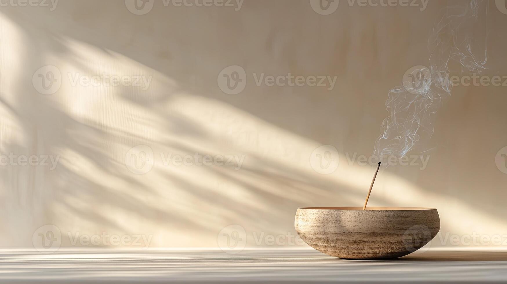 A wooden bowl with incense sticks on it photo