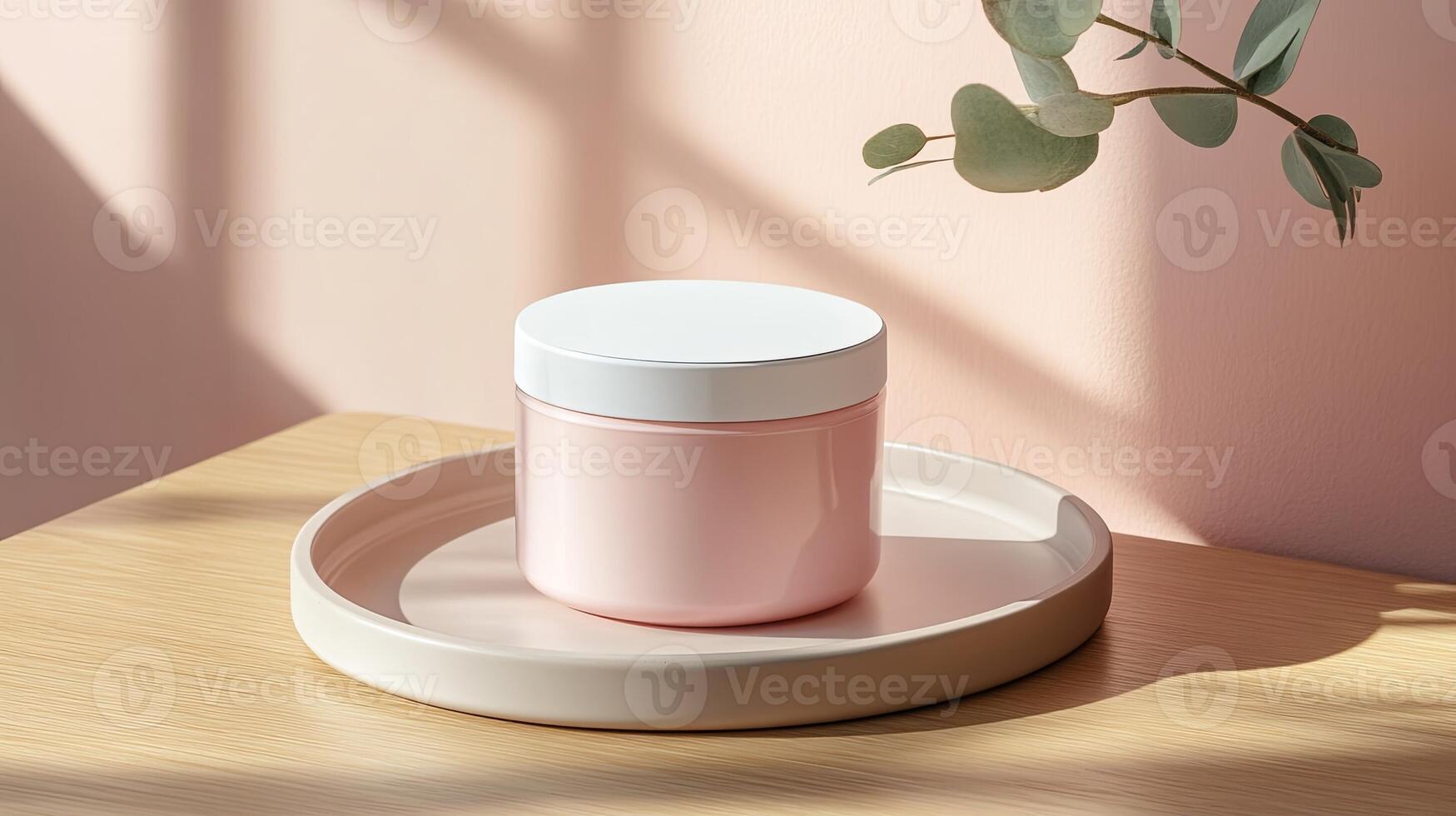 A pink jar with a white lid sitting on a wooden tray photo
