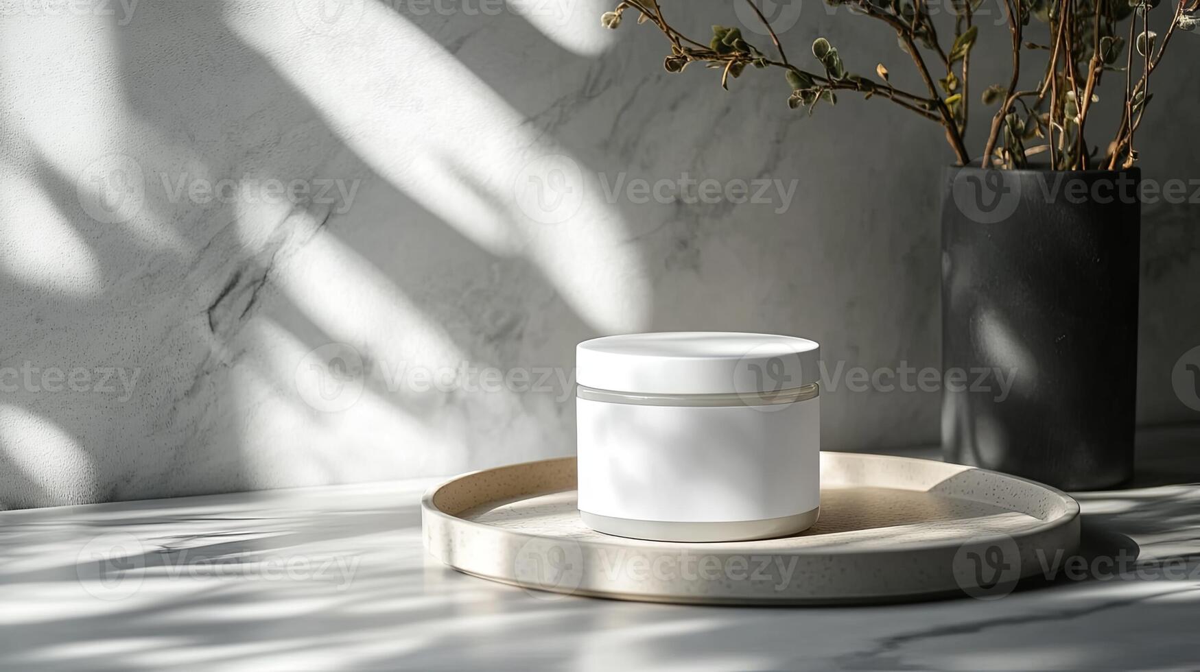 A jar of cream sits on a tray next to a vase photo