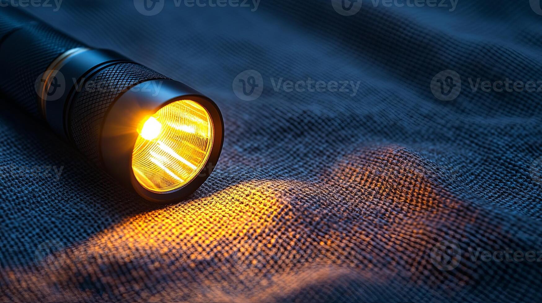 A flashlight is shown on a cloth photo