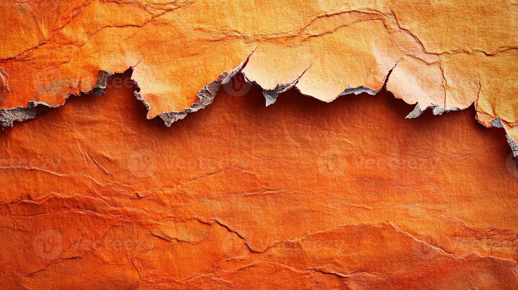 Orange paper texture background with torn edges photo