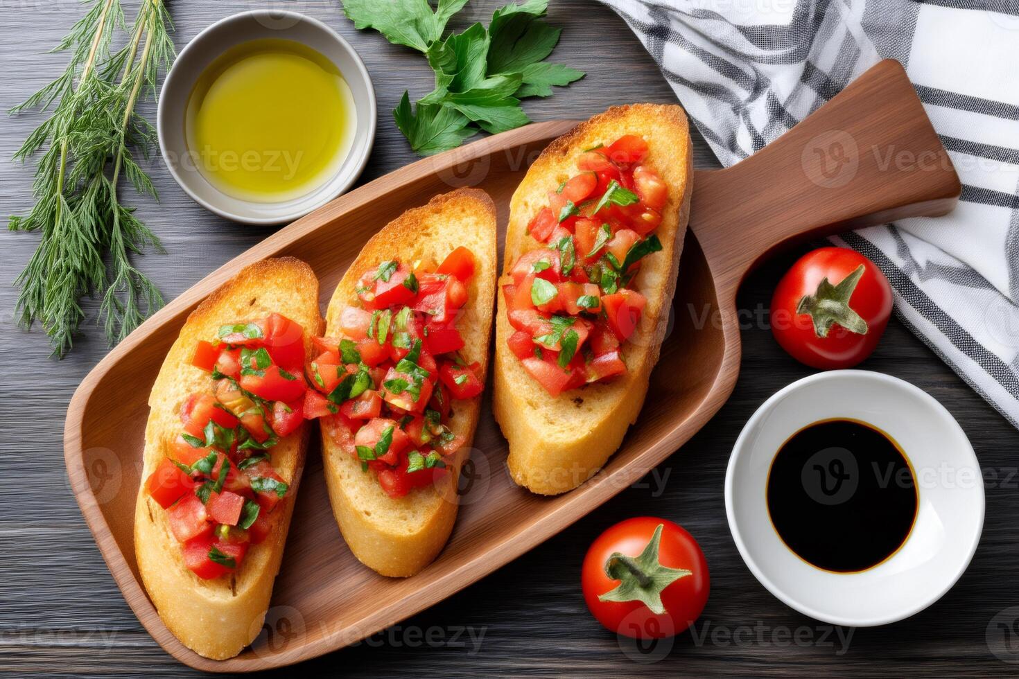 Toasted slices of bread with chopped tomatoes and basil seasoned with olive oil and balsamic vinegar photo