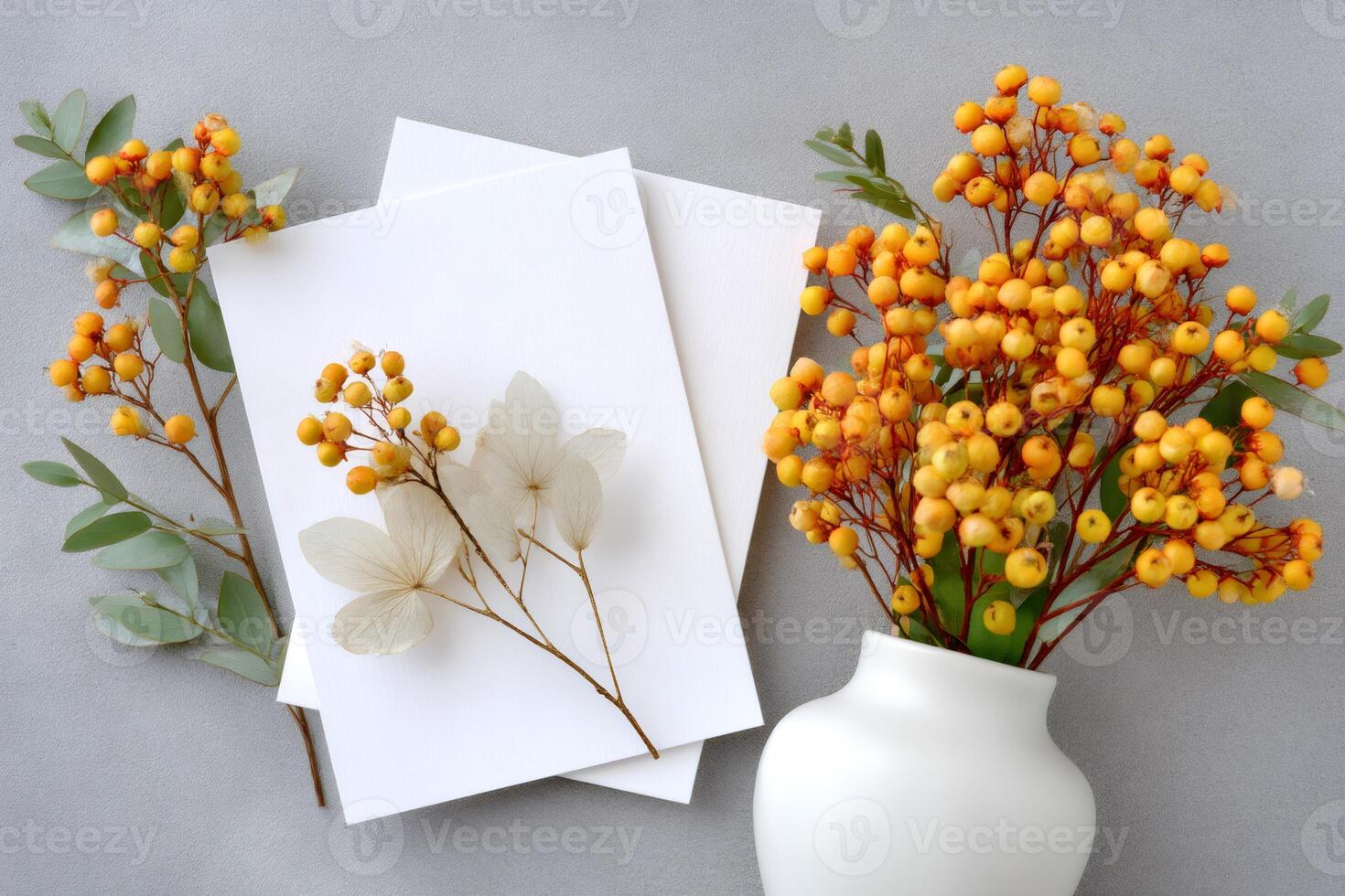 Vibrant yellow berries adding a touch of autumn to blank cards and envelopes photo