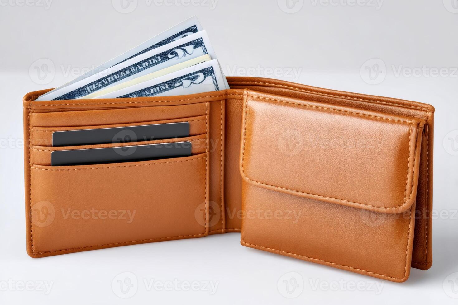 Open brown leather wallet with US twenty dollar bills and credit cards on a white background photo