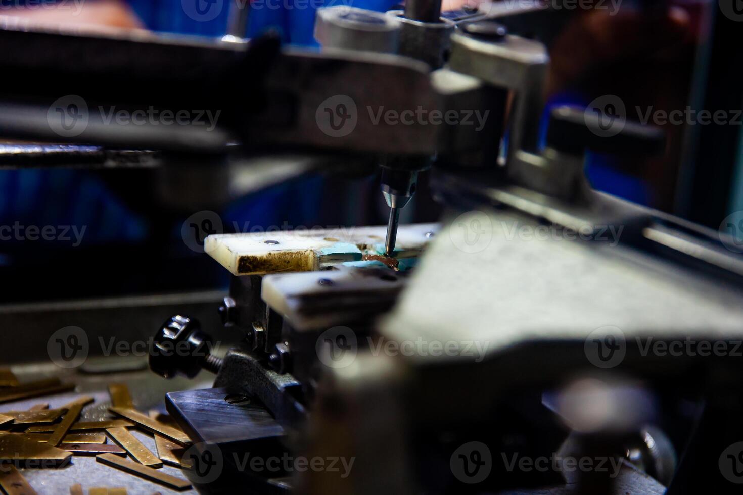 View of the process of Handcrafted engraving of texts on medals or jewelry. photo
