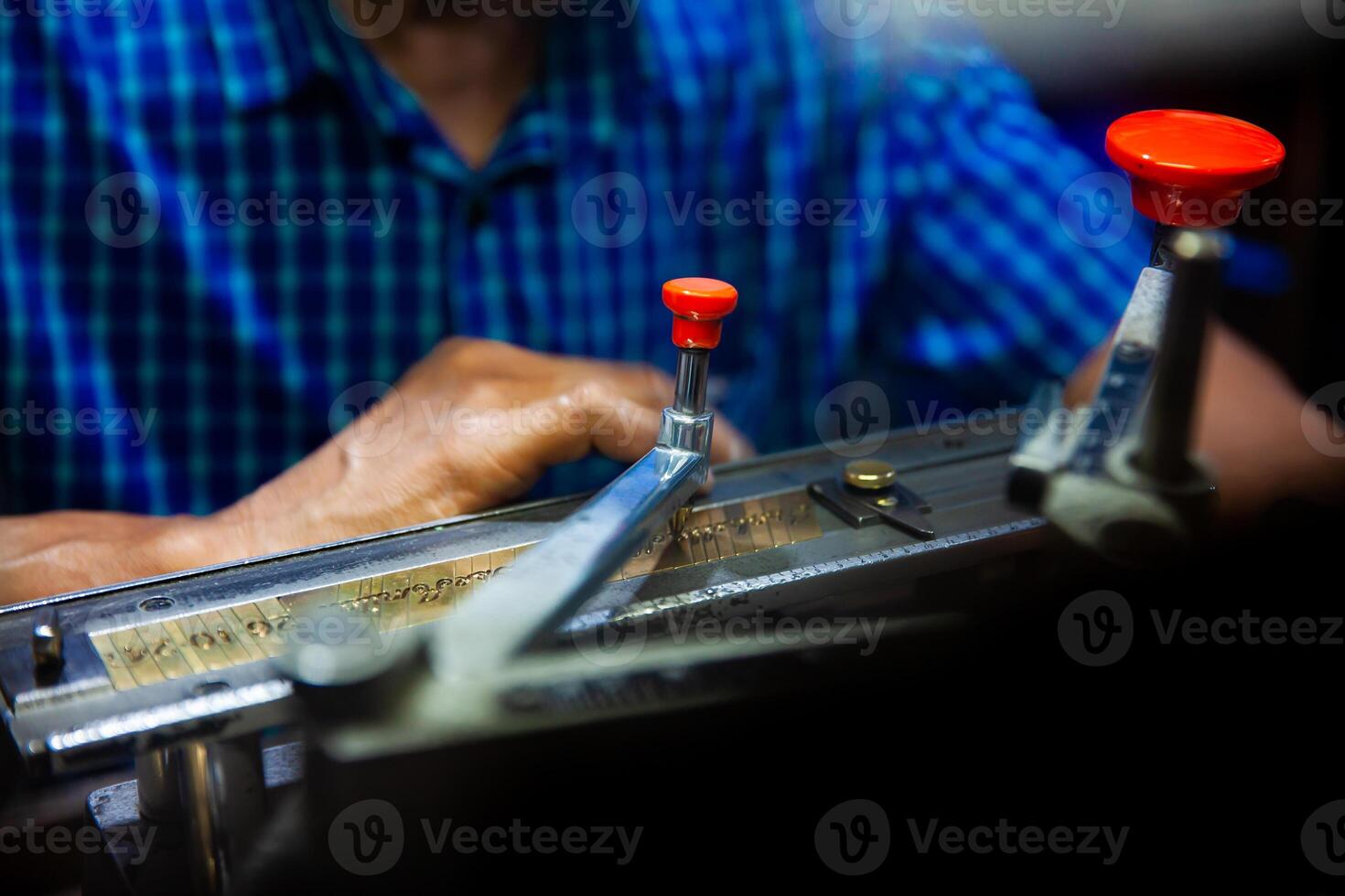 Close up of the process of Handcrafted engraving of texts on jewelry. photo