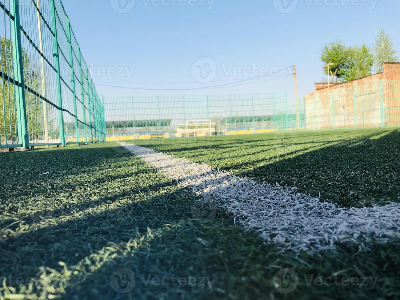 Empty sports field on a sunny day in a rural area photo