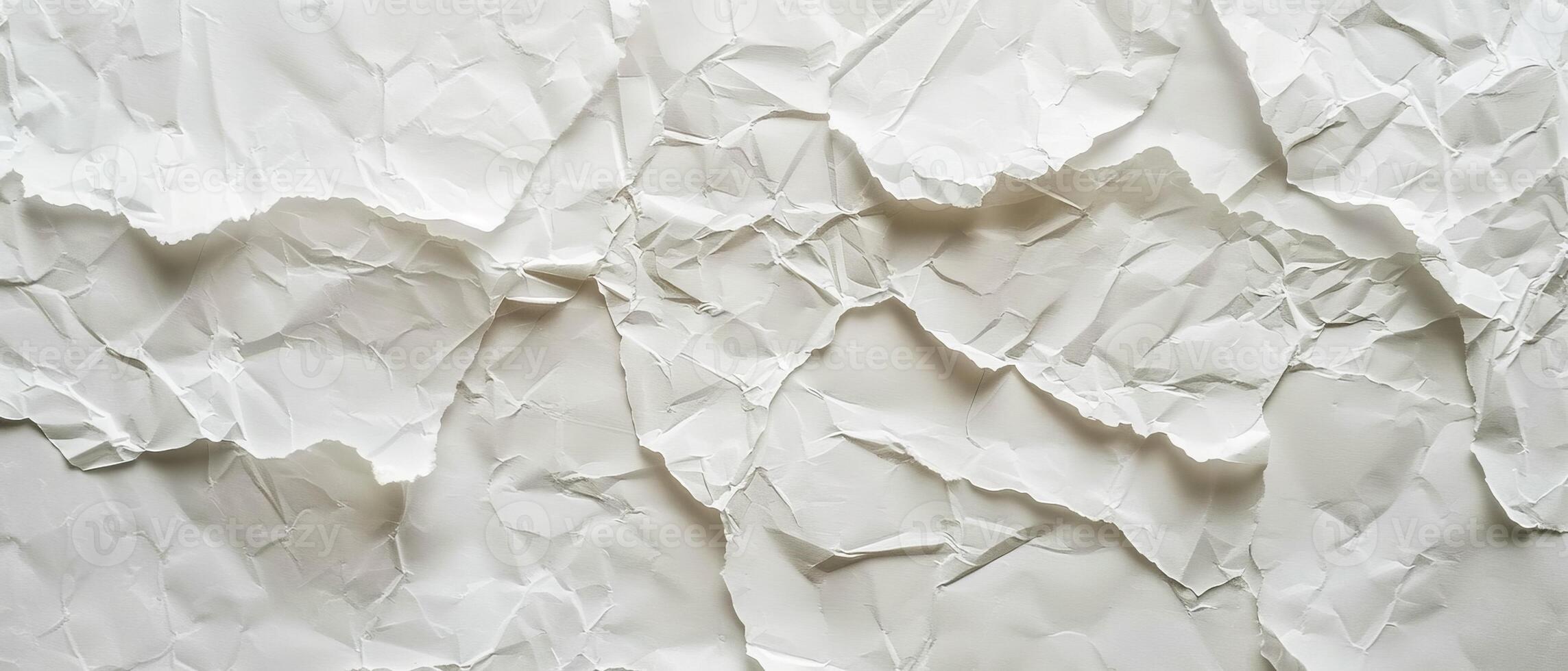 A subtle, crumpled white paper surface showcases elegant folds, providing a canvas for creativity and inspiration in various artistic endeavors photo