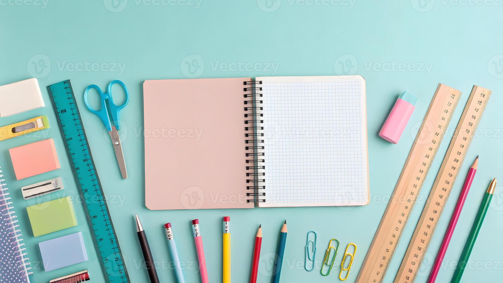 Colorful school supplies arranged on a pastel background for creative projects photo