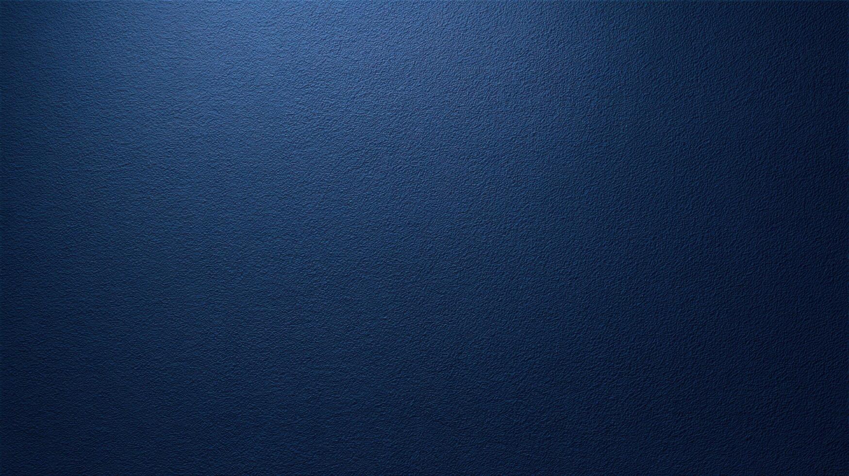 Dark blue textured wall surface with fine grain detail and soft lighting ideal for backgrounds or design backdrops. photo