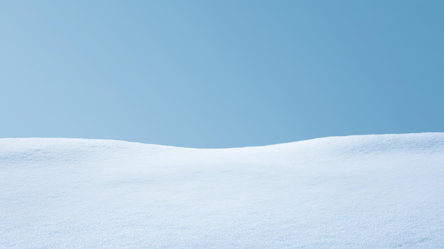 Pure white snow landscape under clear blue sky capturing smooth snow surface with bright sunlight and minimal winter scenery in cold crisp atmosphere. photo