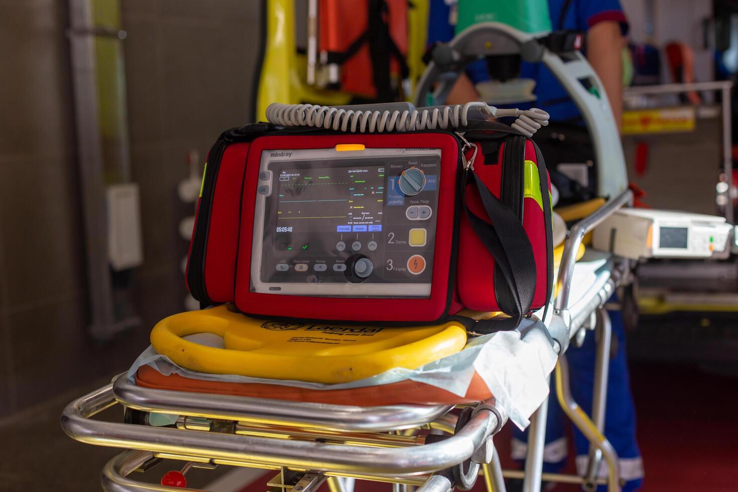 Moscow, Moscow region, Russia - 03.09.2023.Emergency medical monitor and defibrillator on a stretcher with CPR board in an ambulance photo