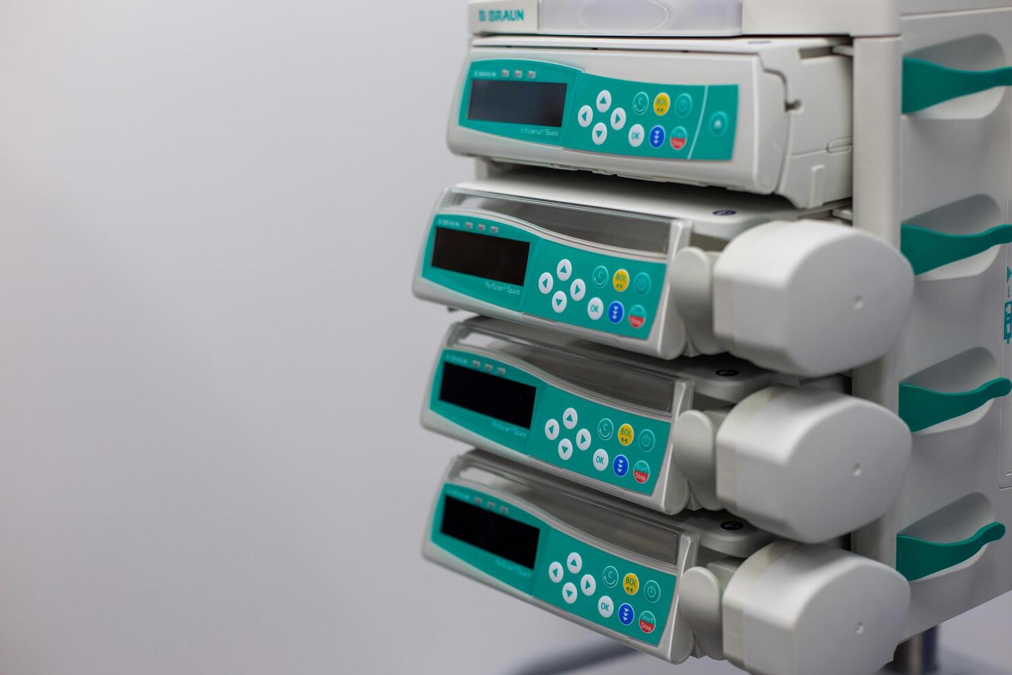 Moscow, Moscow region, Russia - 03.09.2023.Close-up view of medical infusion pumps with display screens and control buttons photo