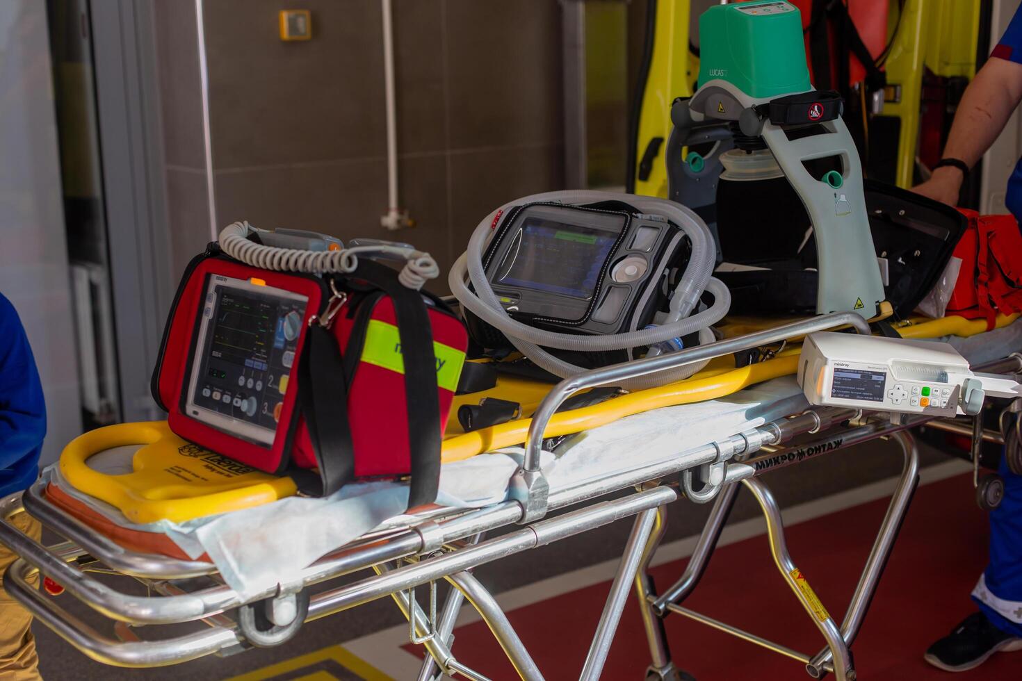 Moscow, Moscow region, Russia - 03.09.2023.Diverse emergency medical devices, including a monitor and a defibrillator, mounted on a stretcher in an ambulance. photo