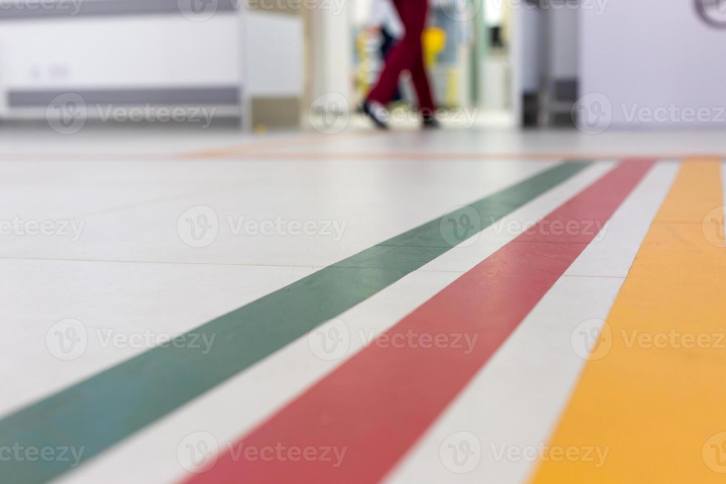 Colorful guide lines on the floor of the hospital corridor for navigation . photo