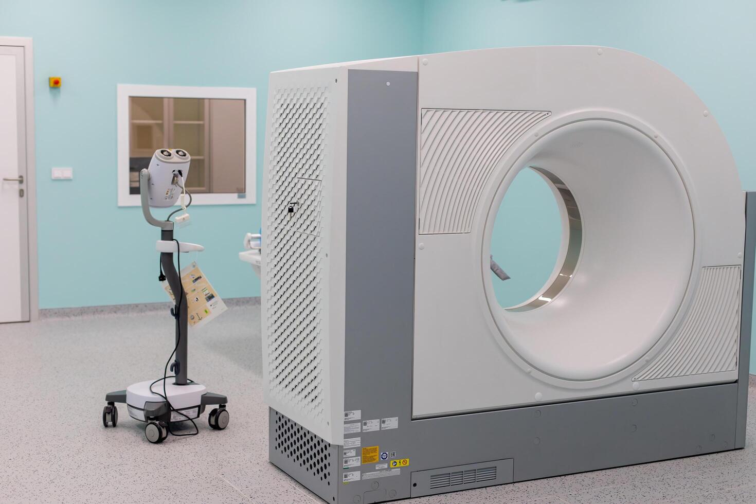 Moscow, Moscow region, Russia - 03.09.2023.A high-tech CT scanner in a clean, empty hospital radiology room photo
