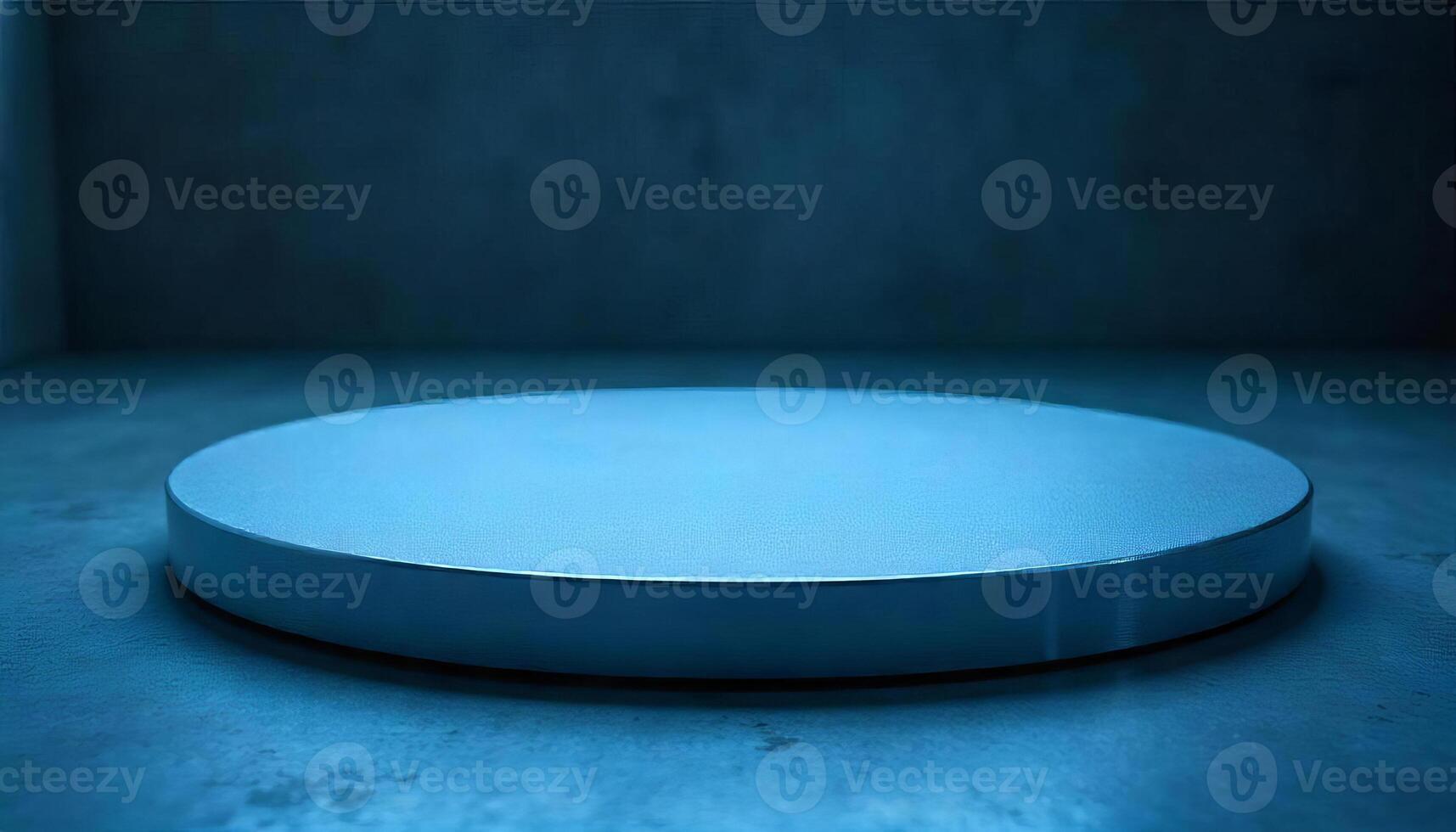 A round white platform with a metallic edge, on a blue surface, against a dark blue background photo
