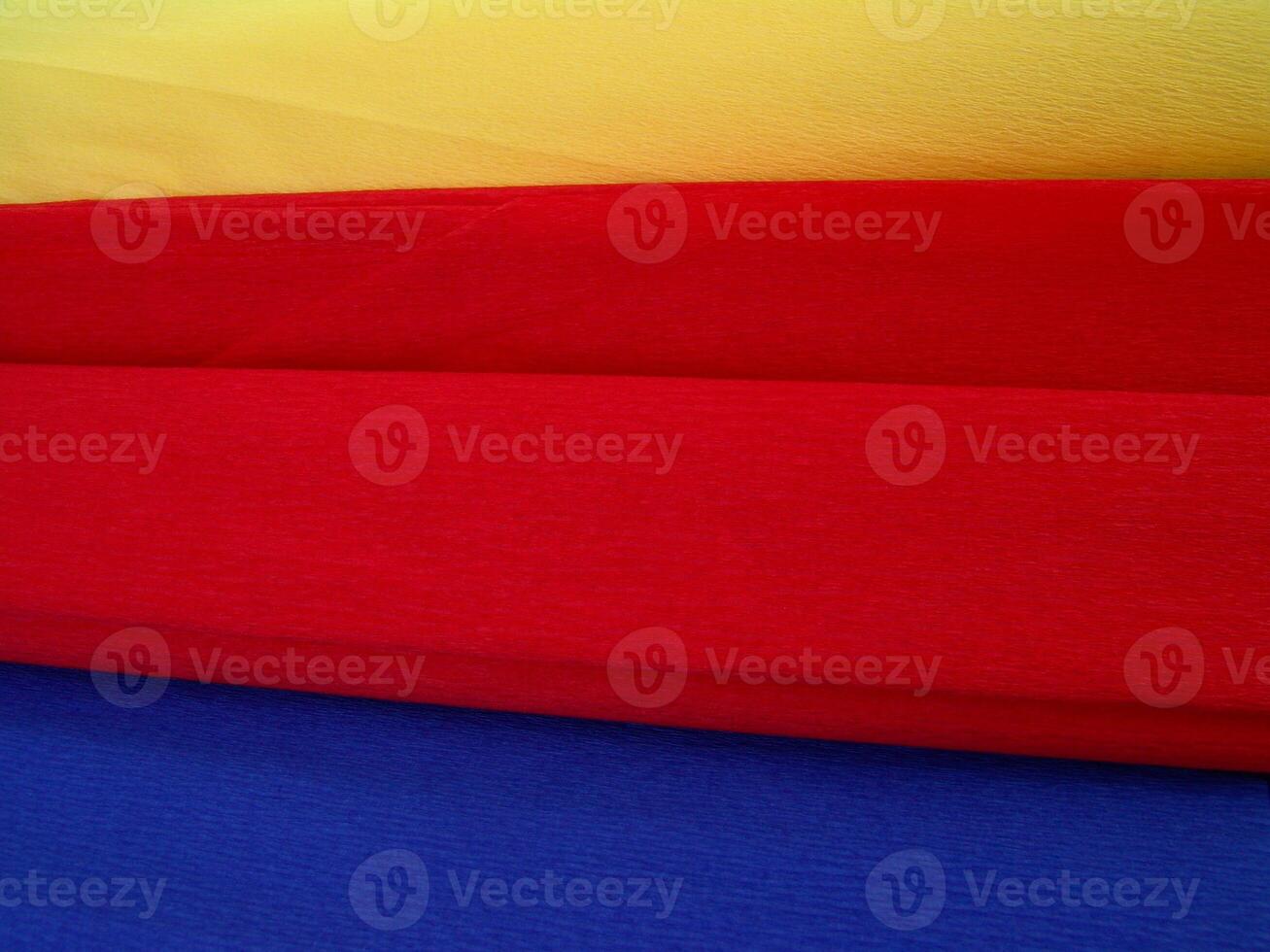 Red, yellow and blue paper pieces close view background wallpaper photo