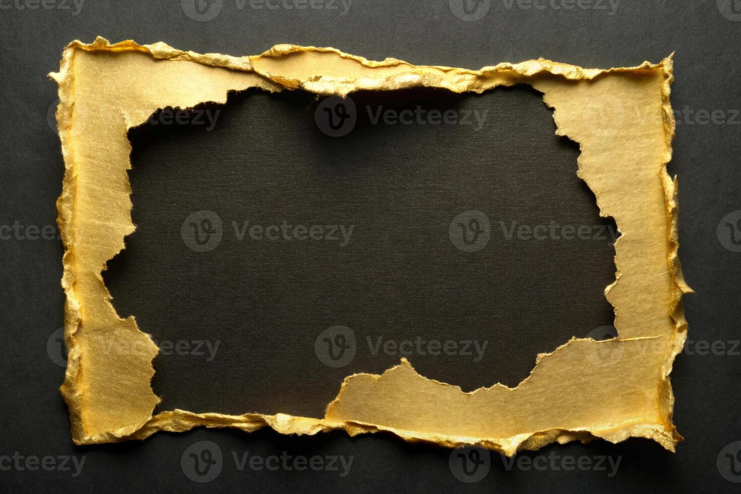 Gold textured torn paper frame on a dark background for business presentations and design projects photo