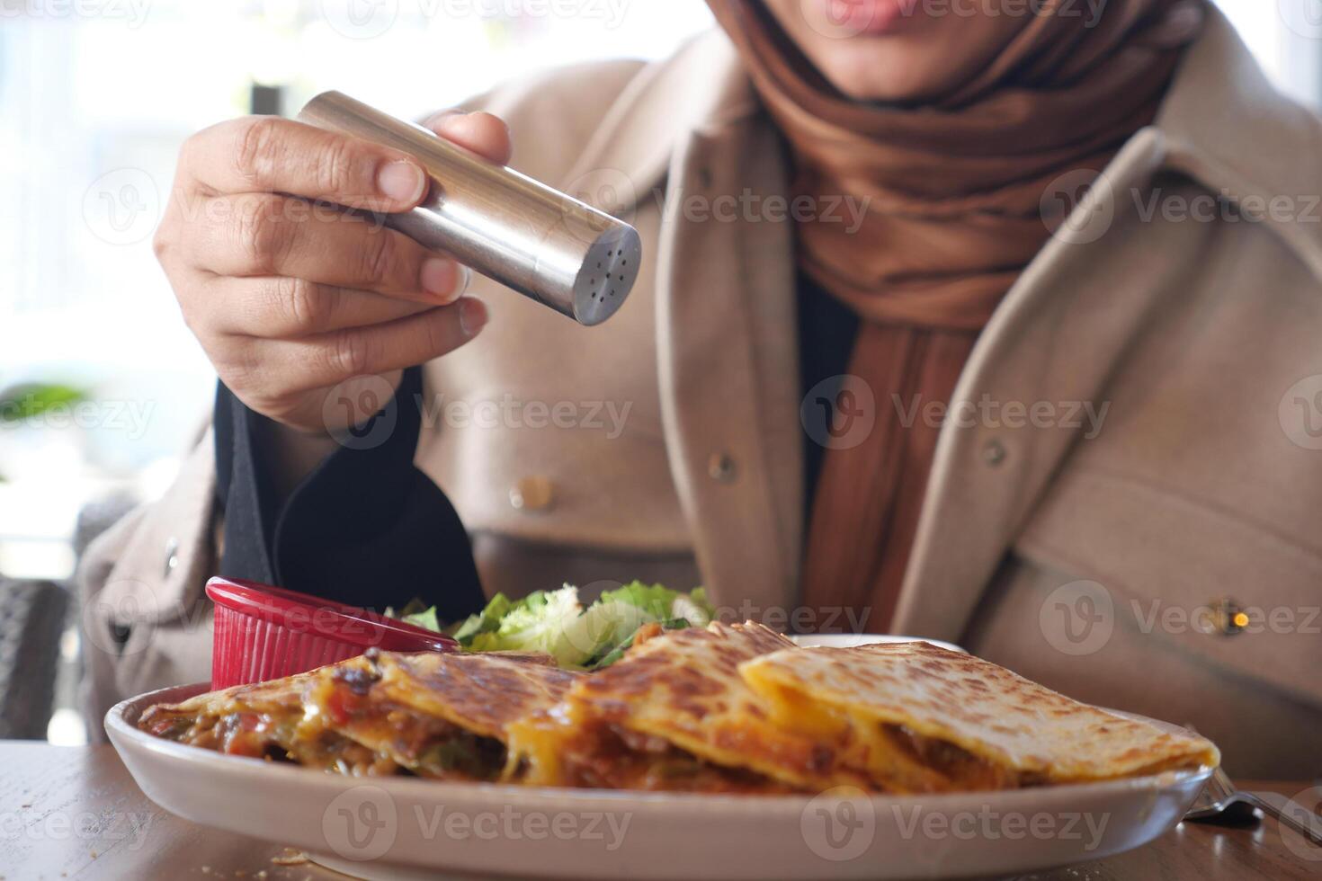 Enjoying a flavorful meal at a cozy restaurant in the afternoon photo