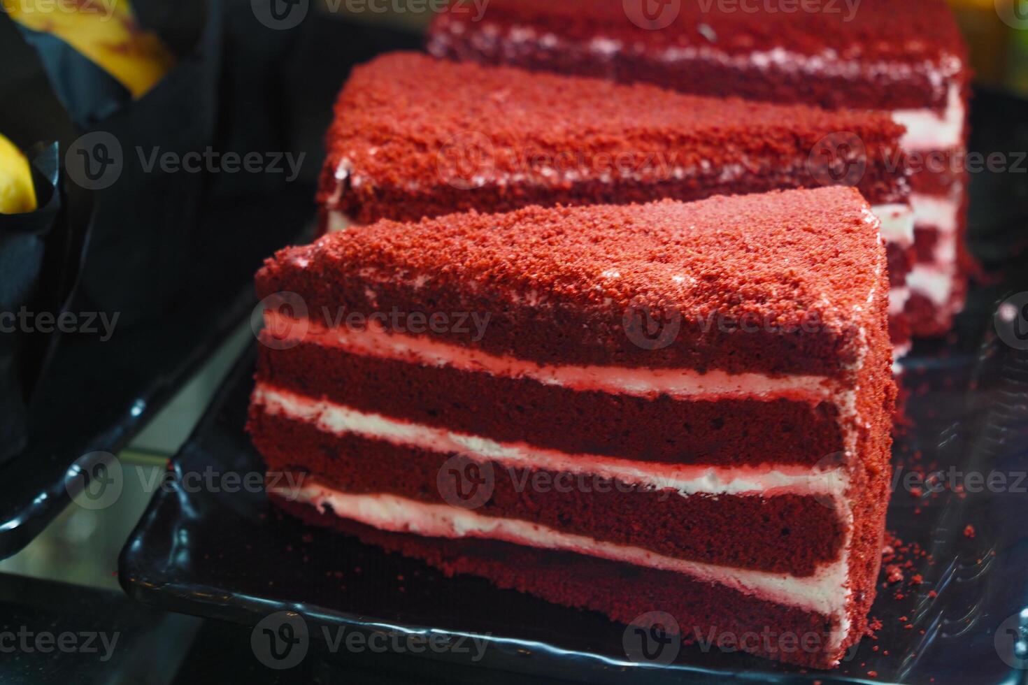Red velvet cake slices displayed at a dessert shop during daytime photo