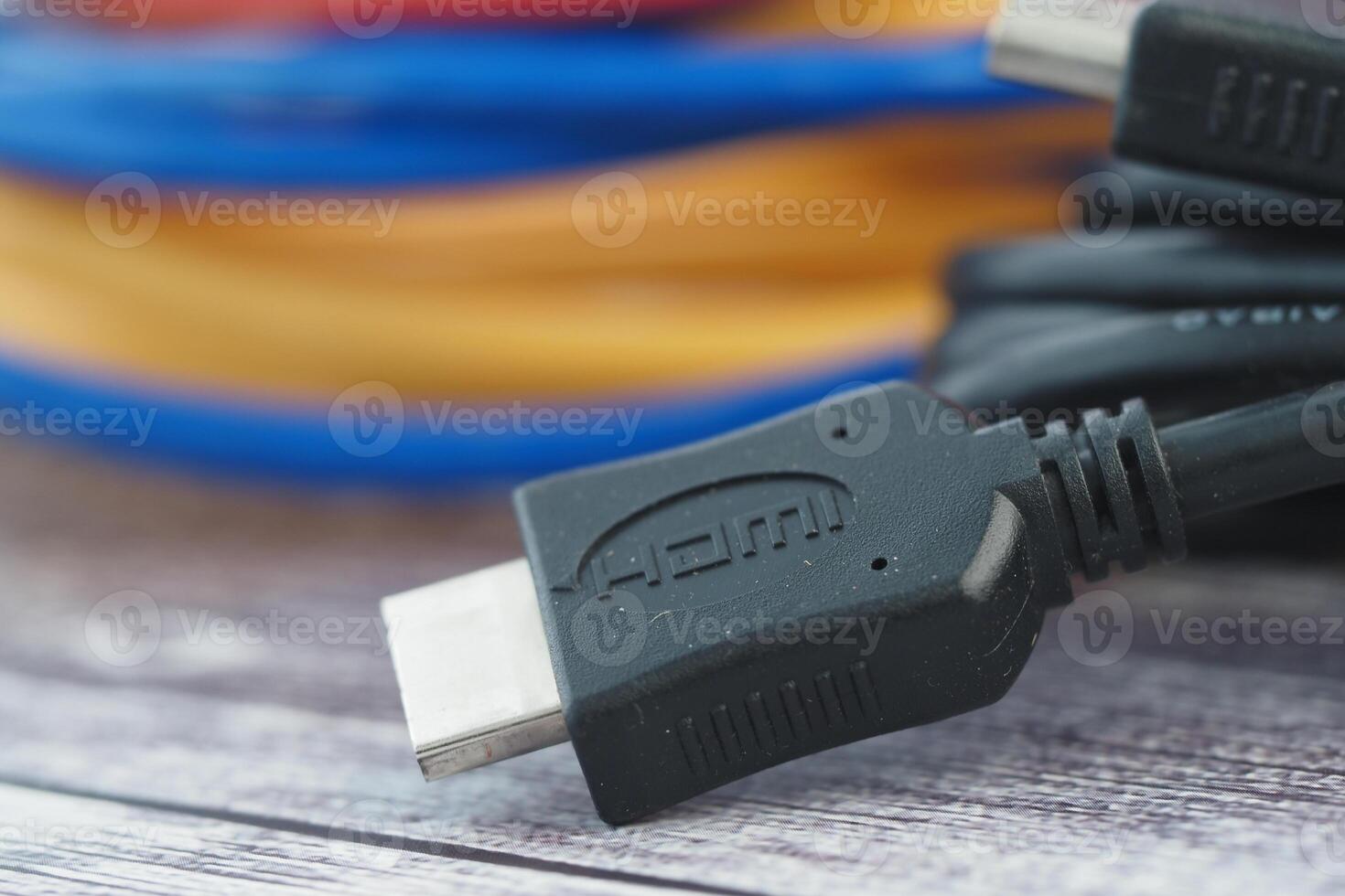 Close-up of an HDMI cable connector and colorful cables photo