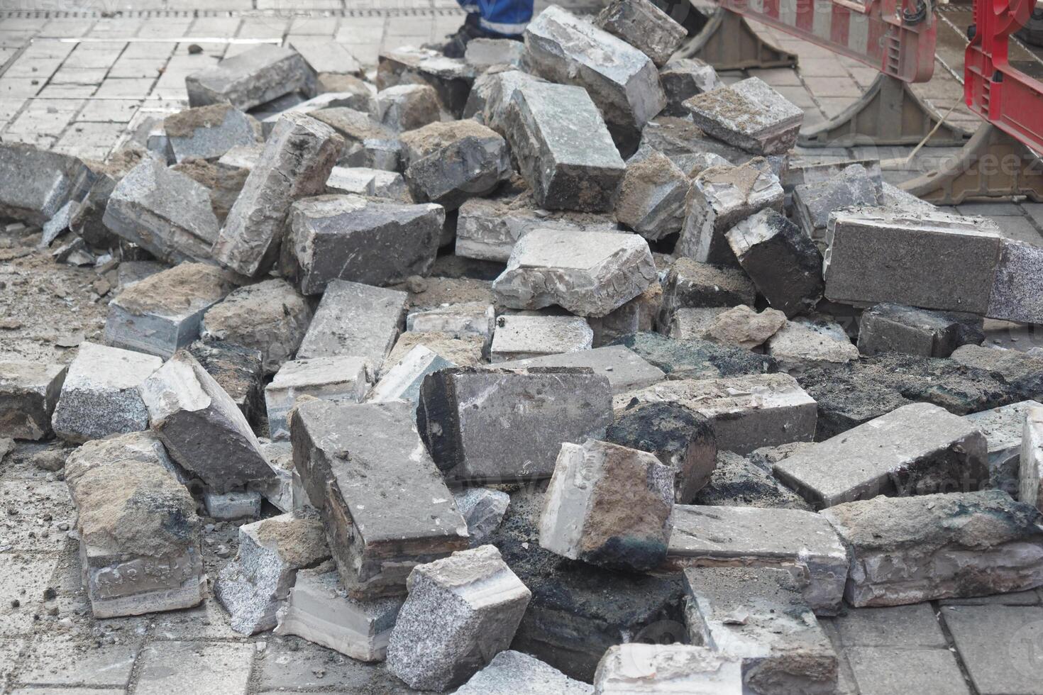 Construction site debris accumulated on a city street photo