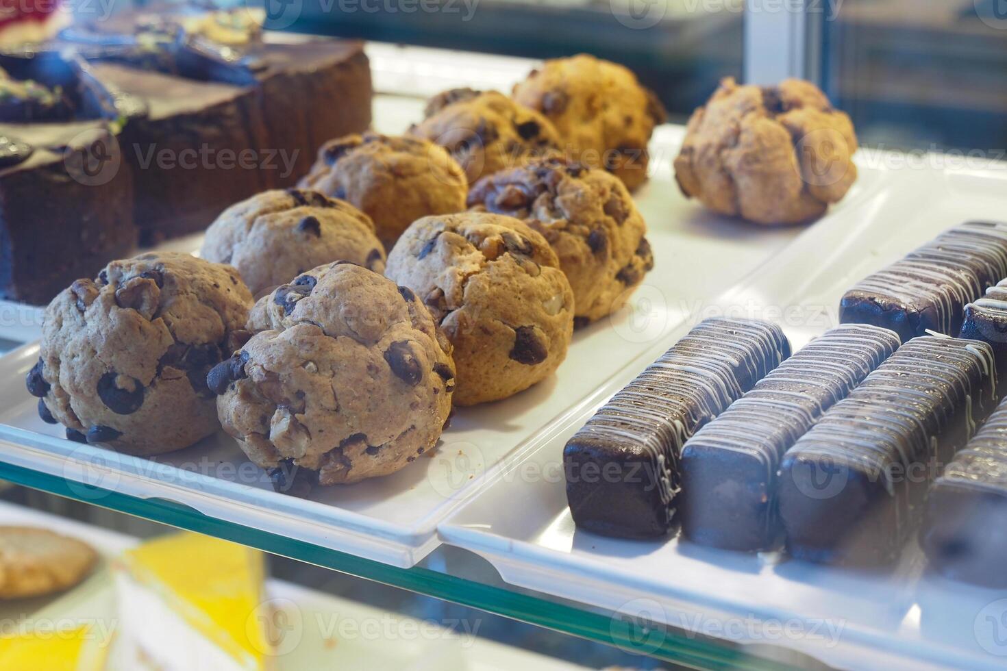 Delicious baked treats in a display case at a local bakery shop photo