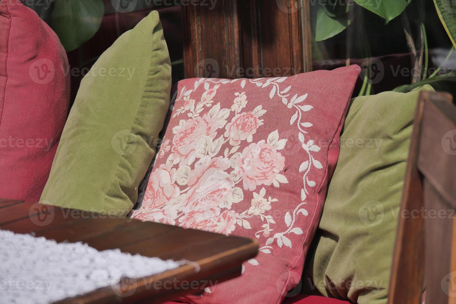 Cozy outdoor seating area with colorful cushions in a garden setting photo
