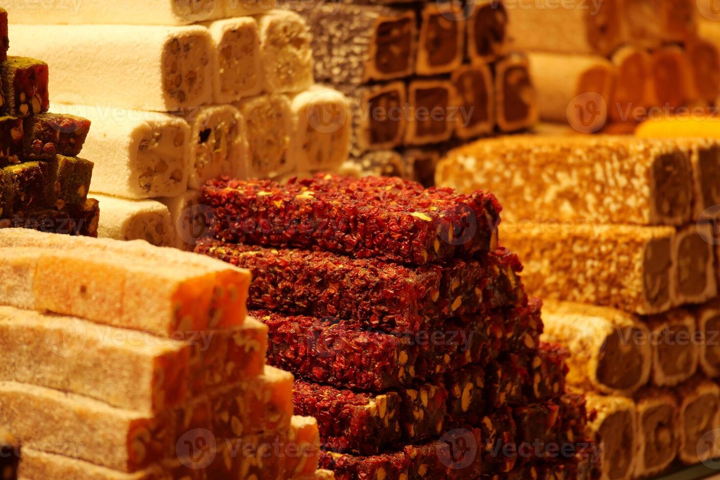 Colorful display of turkish delight sweets in a bustling market photo