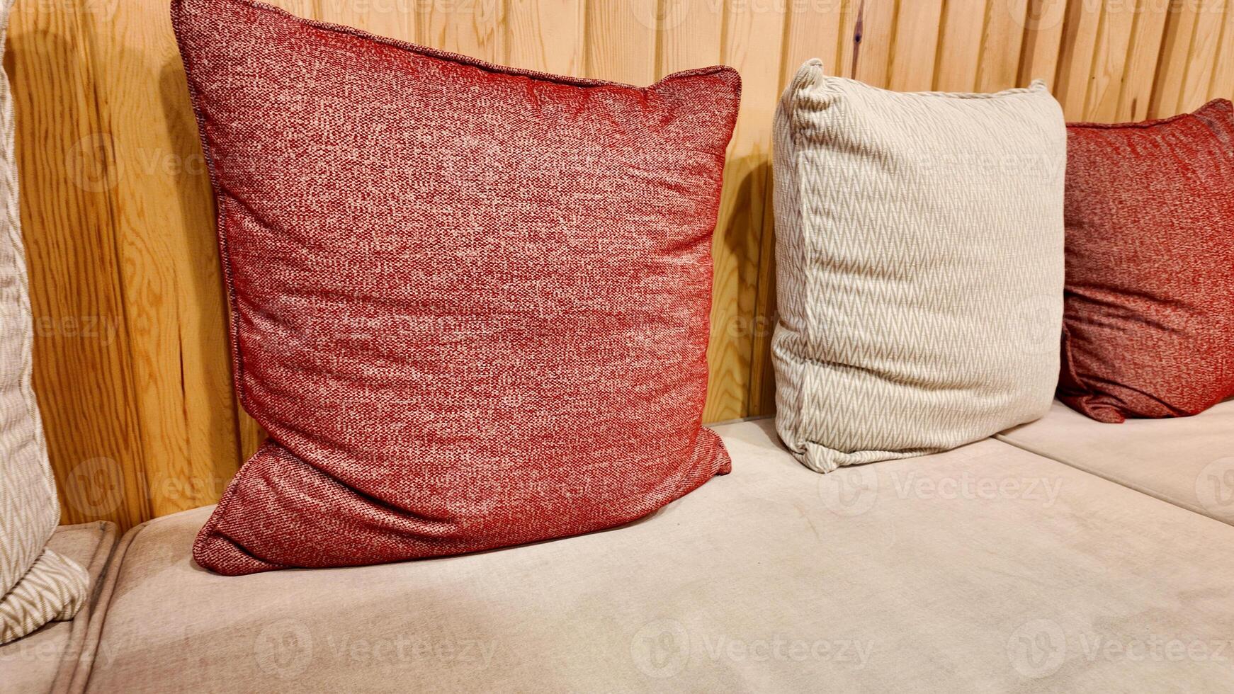 Cozy cushions arranged neatly on a stylish sofa in a warm setting photo