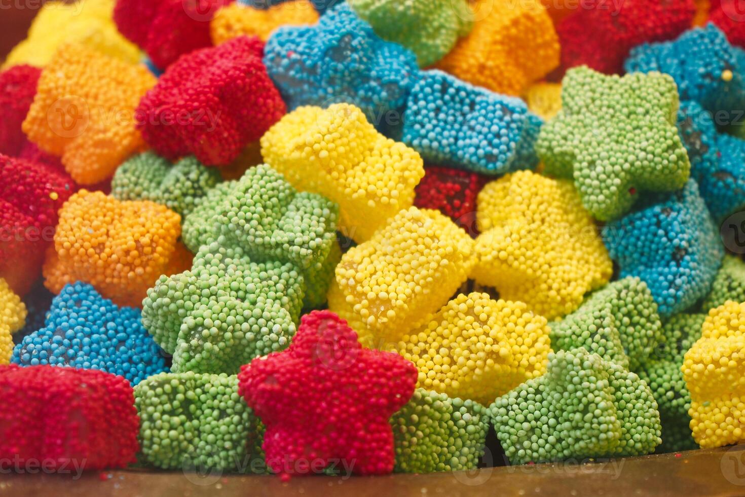 Colorful candy shapes in vibrant hues at a market photo