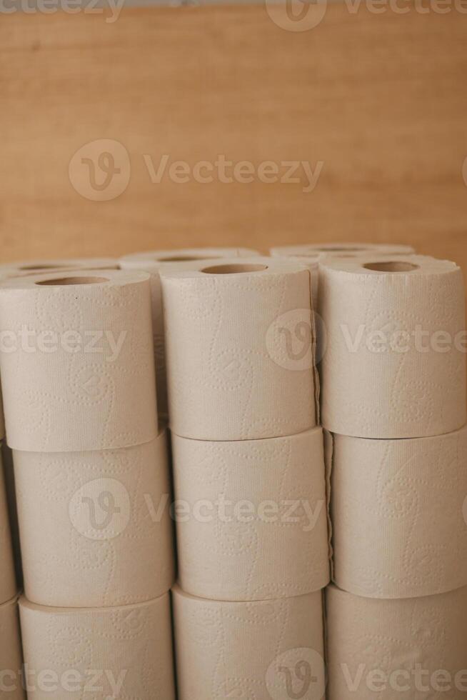 Stacked rolls of natural bathroom tissue in a cozy setting photo
