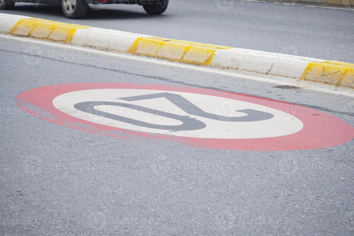 Speed limit sign on a road in an urban area during the day photo