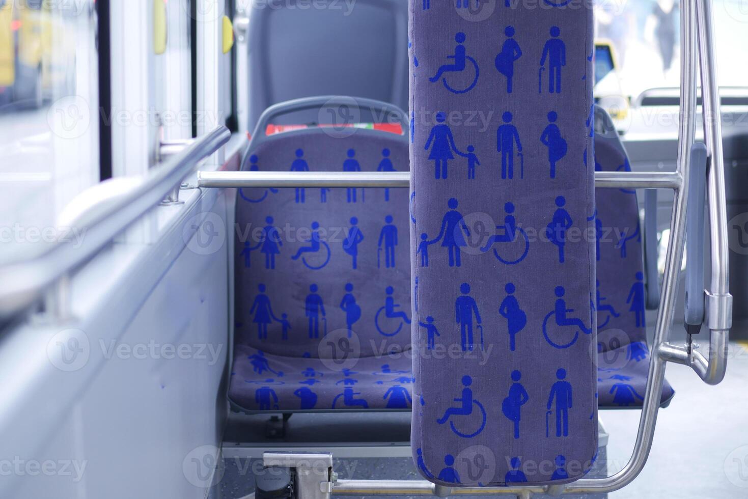 Seating area designed for accessibility on public transport bus photo