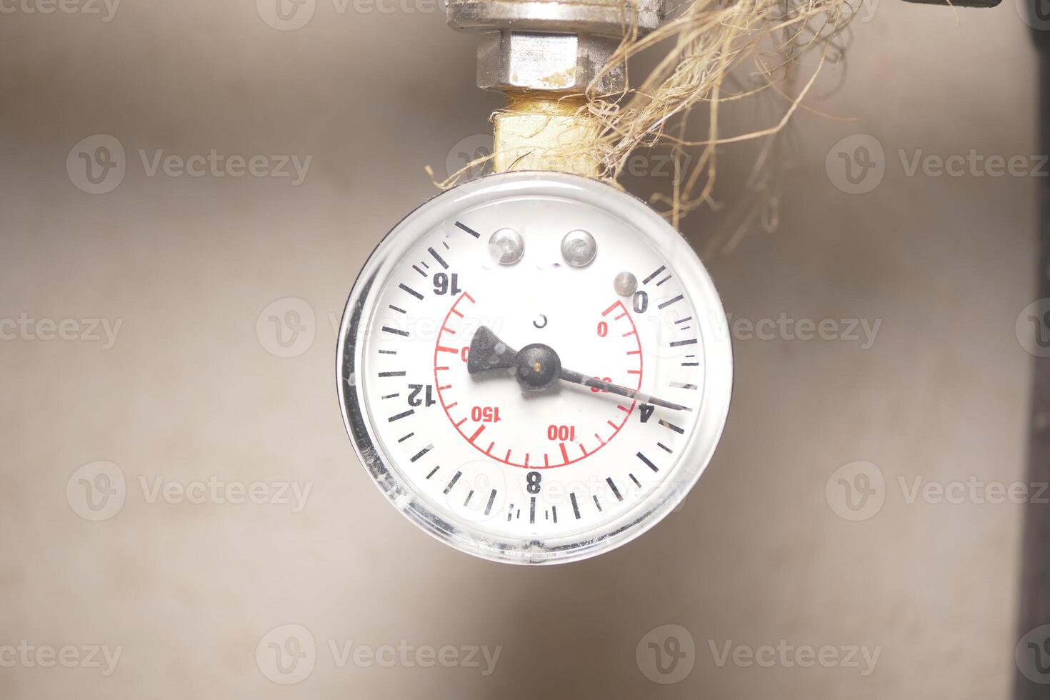 Pressure gauge showing measurement in industrial setting photo