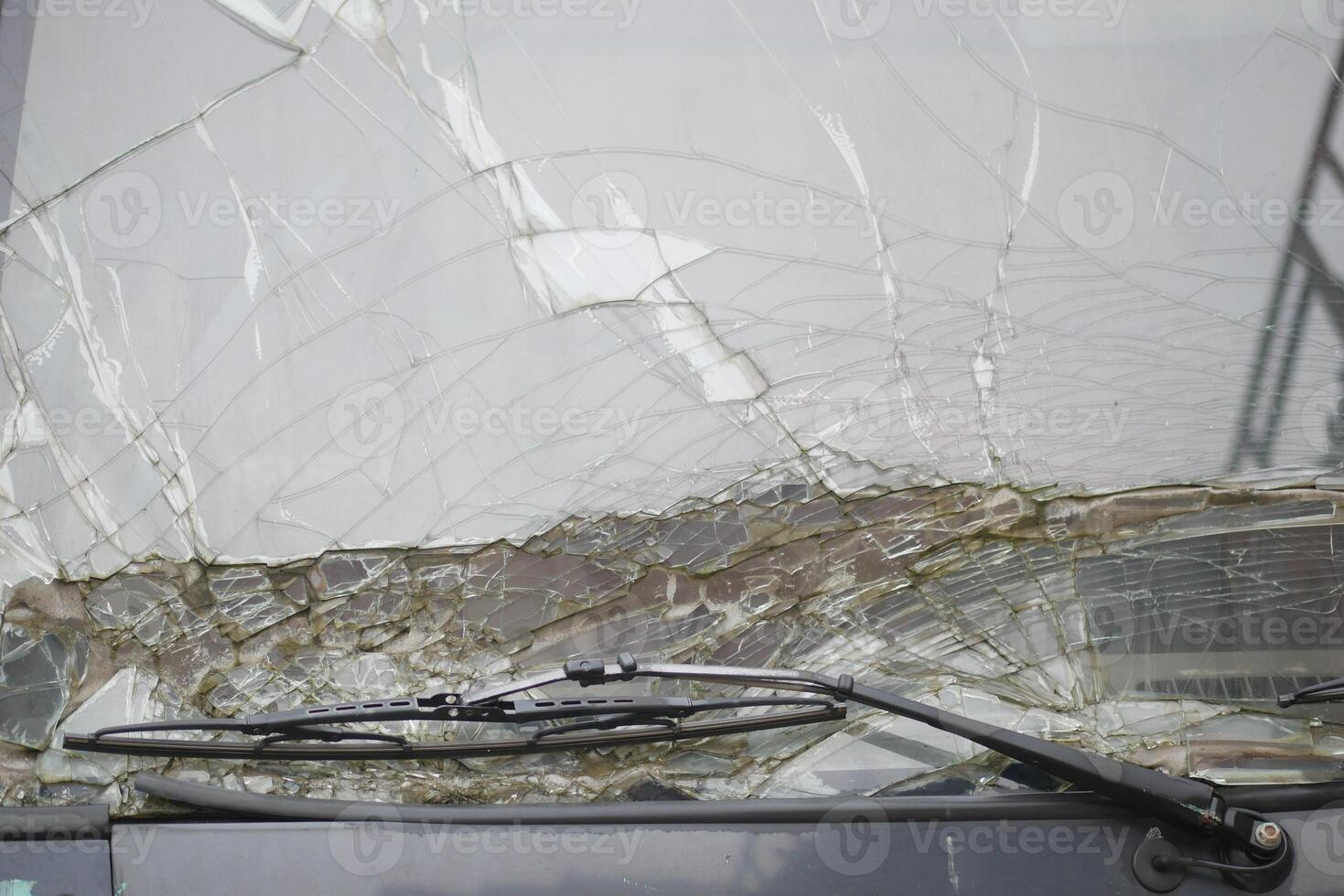 Windshield damage on a bus during a stormy weather event photo