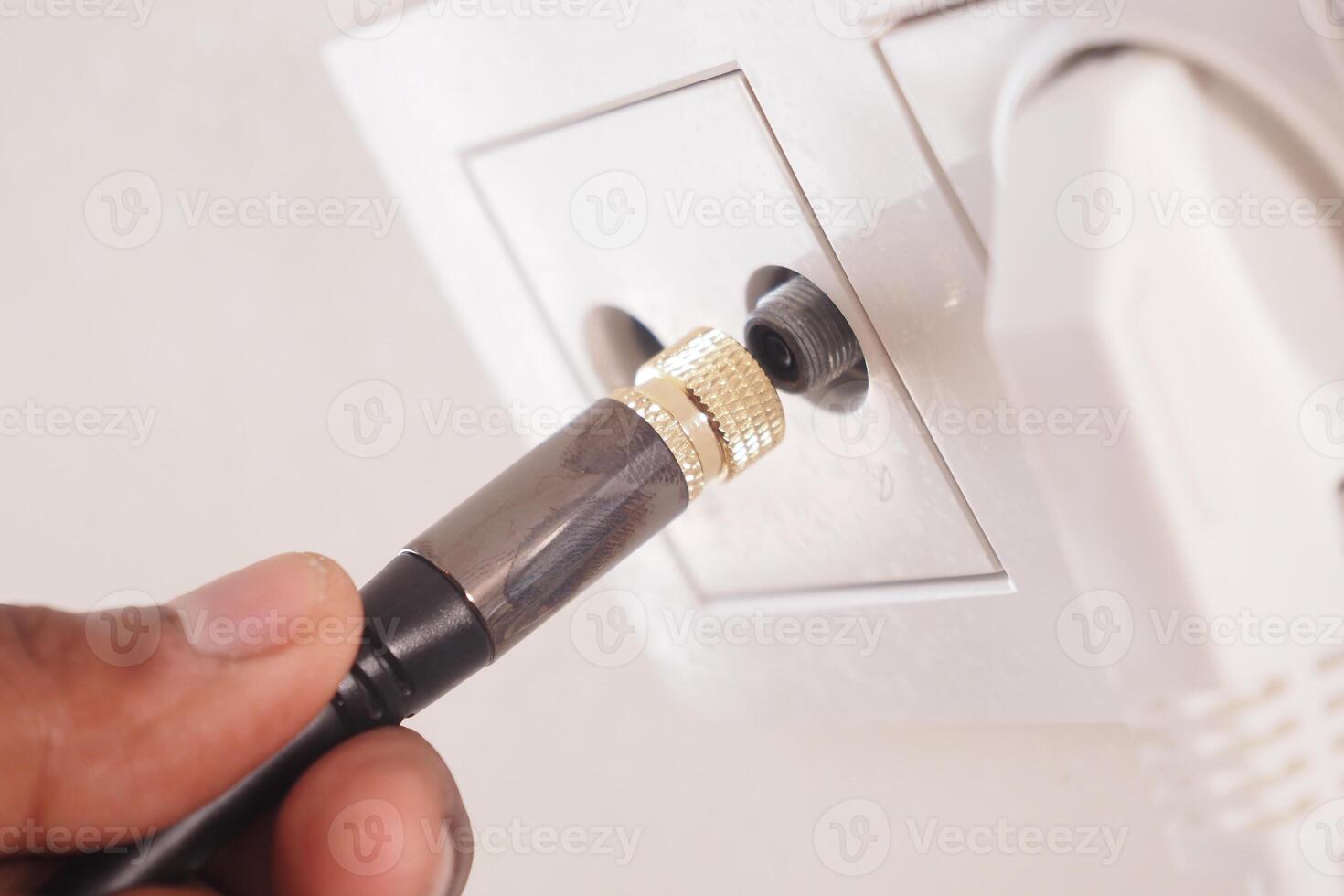 Close-Up of Cable Connection in Wall Socket for Electrical or AV Systems photo