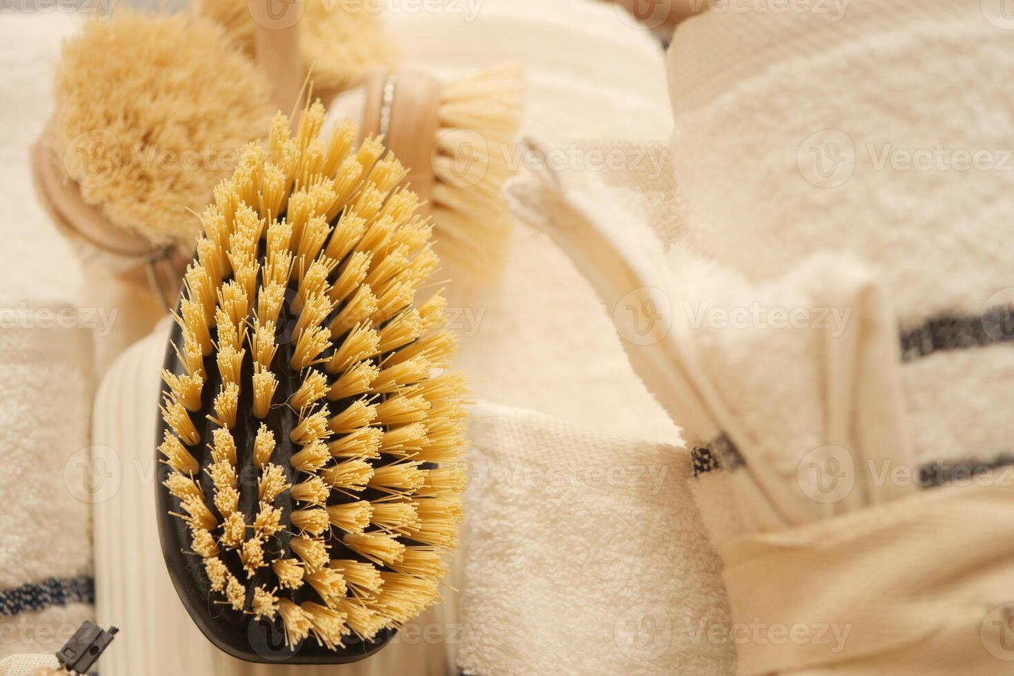 Detail of cleaning brushes and towels organized in a tidy setting photo