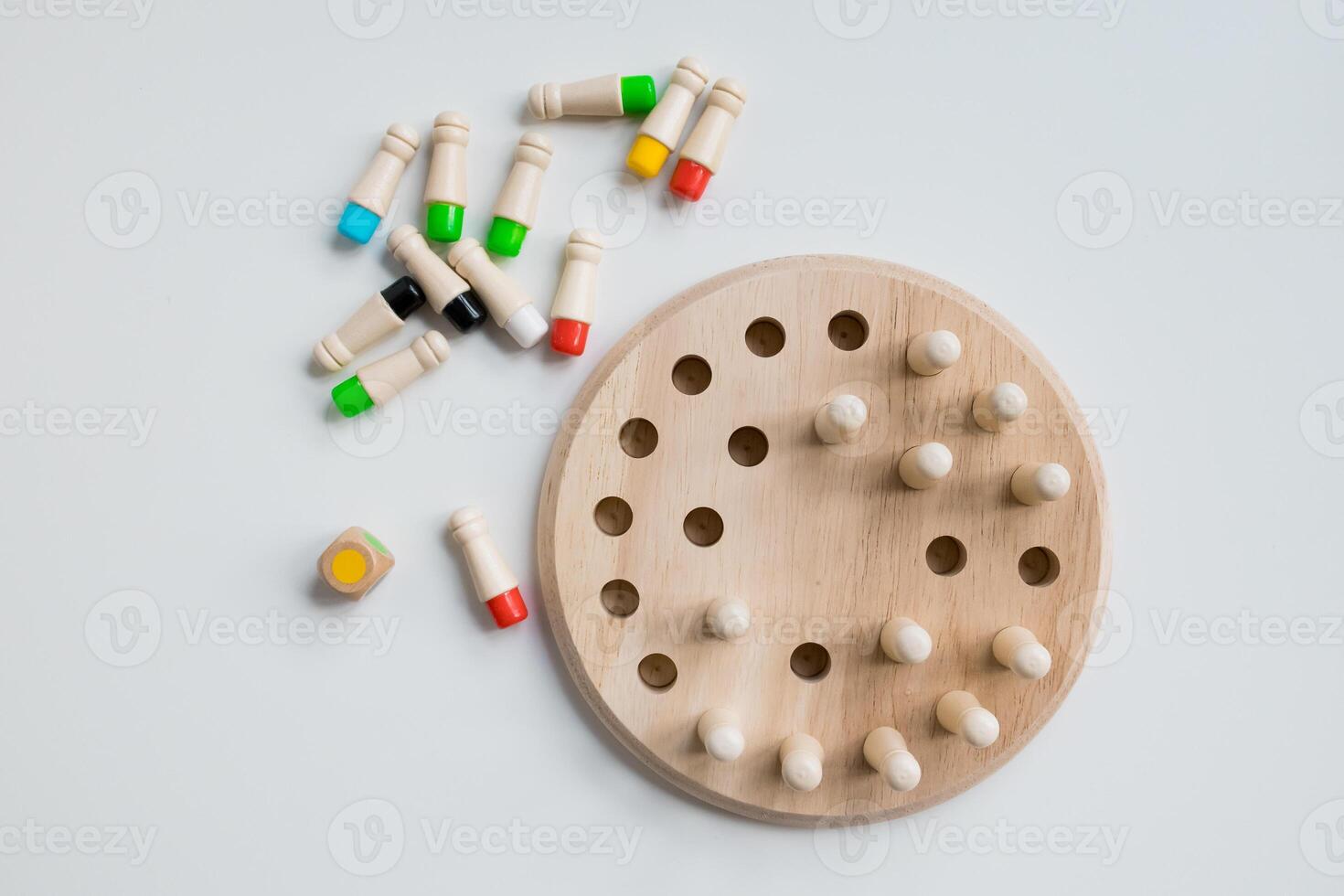 Wooden Montessori counting game with colorful pegs and dice photo