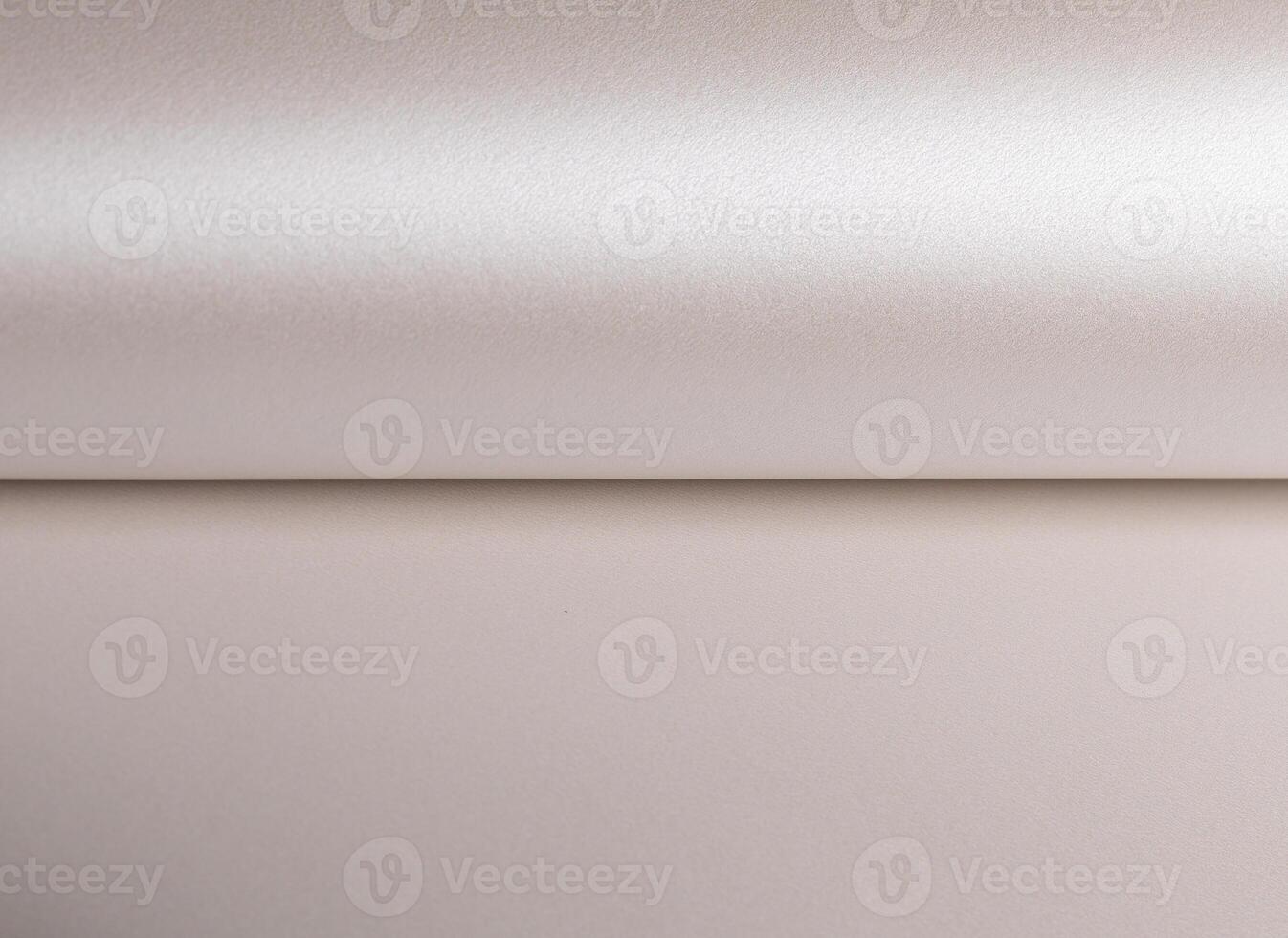 Paper background with pearlescent texture. Smooth satin surface in soft champagne and pale gold photo
