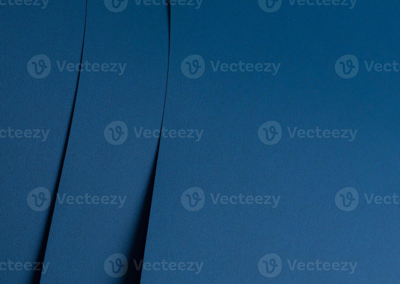 Paper background with matte texture. Folded arc shape in cobalt blue, deep blue, and ocean blue photo
