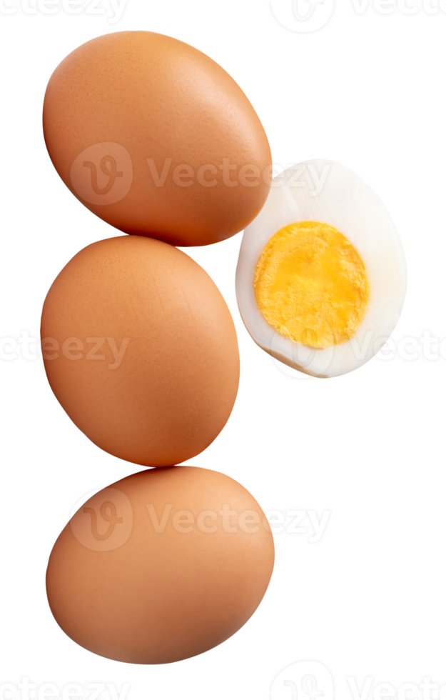 Raw brown chicken eggs and cooked or boiled chicken egg with egg yolk in half in stack isolated in file format png