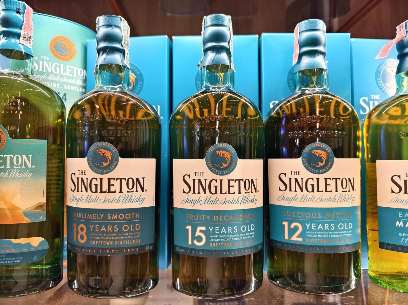 PHUKET, THAILAND - MARCH 8, 2025. Bottles of whiskey The Singleton on a shelf in a supermarket photo