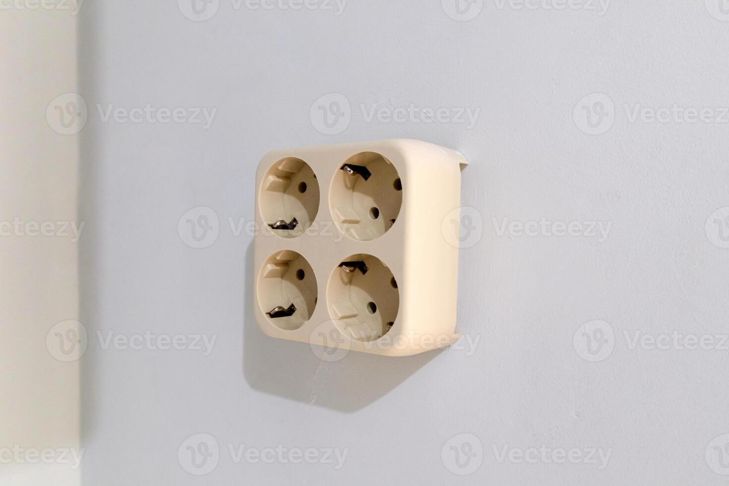 Wall electrical socket with four plug holes photo